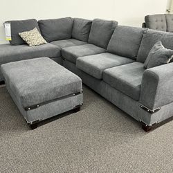 New Reversible Sectional W Ottoman.  Grey Chenille Fabric.  112” X 84”.  Free Delivery!