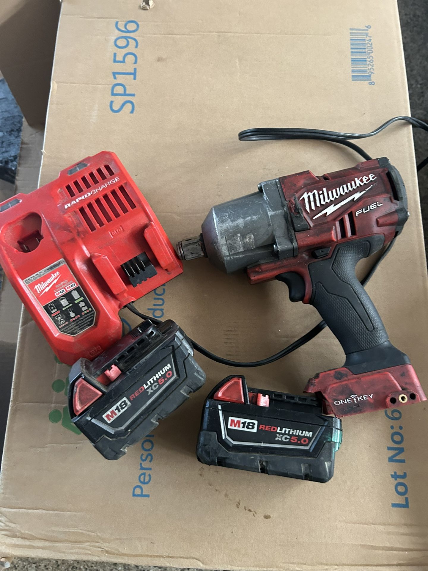 Milwaukee 3/4 Impact. 2 - 5.0 Batteries And Rapid Charger