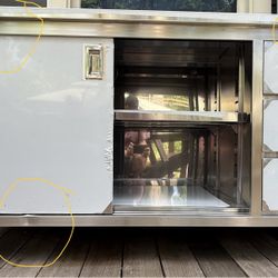Regency 24" x 60" 16 Gauge Type 304 Stainless Steel Enclosed Base Sliding Door Table with Drawers