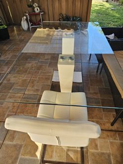 Dining Table With Chairs And Ornaments.