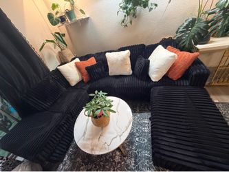 Black corduroy sectional couch with movable ottoman