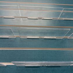 Tons of Plastic Shelves That Hang Off Slated Walls In A Store