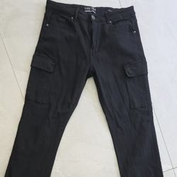 Man's black jeans relaxed feet