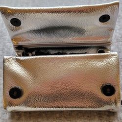   Woman's Metalic Silver Clutch