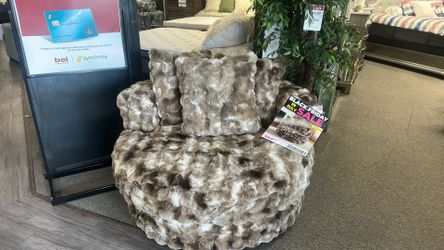Swivel chair with plush pillows