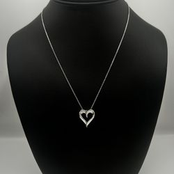 Gorgeous 925 sterling silver heart shaped pendant with embedded 0.5 carat diamonds and beautiful chain!
