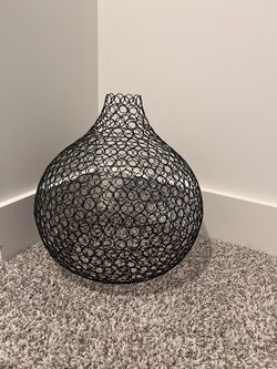 Black metal wire accent piece.