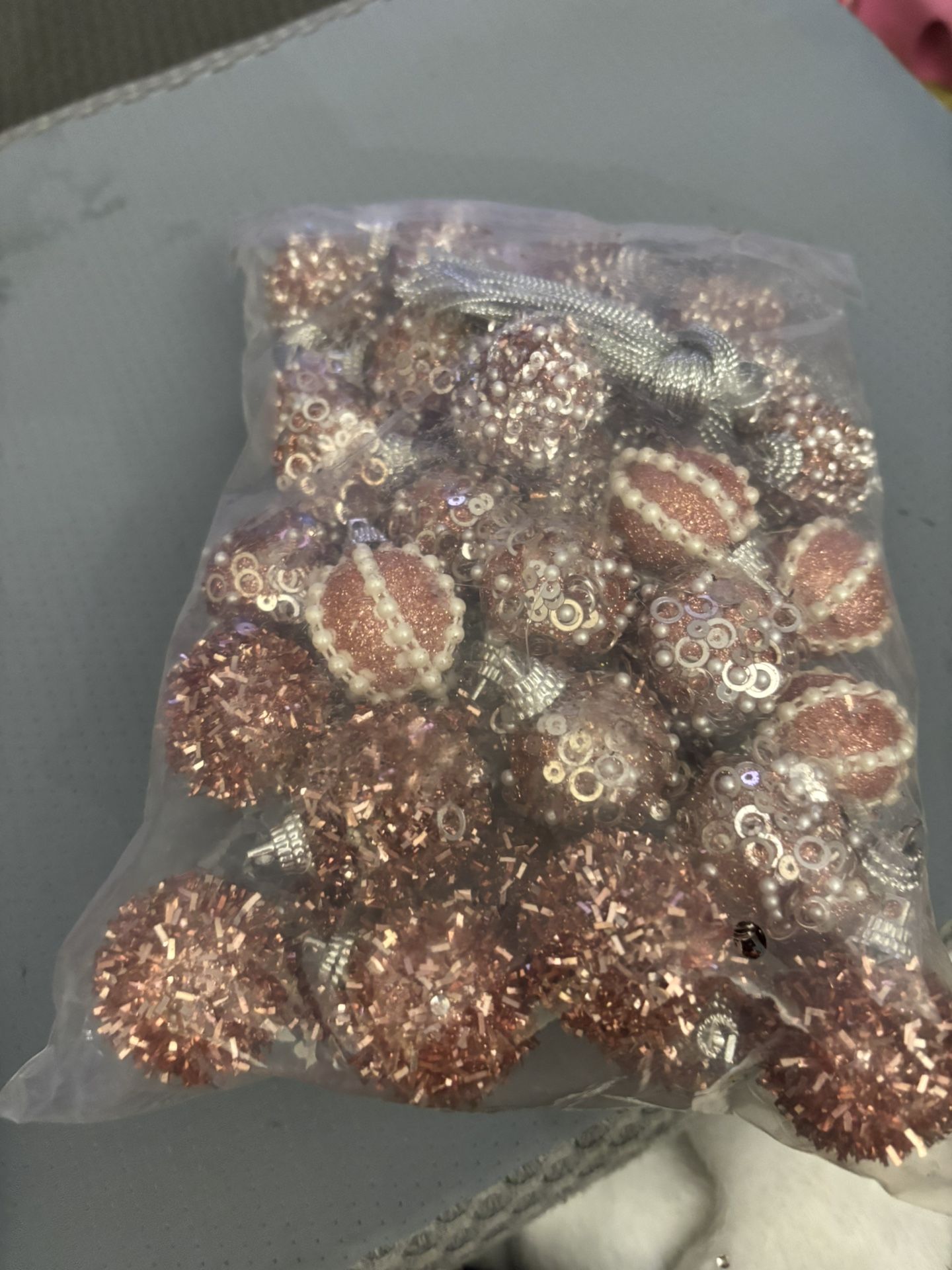 New bag of mini pink ornaments
