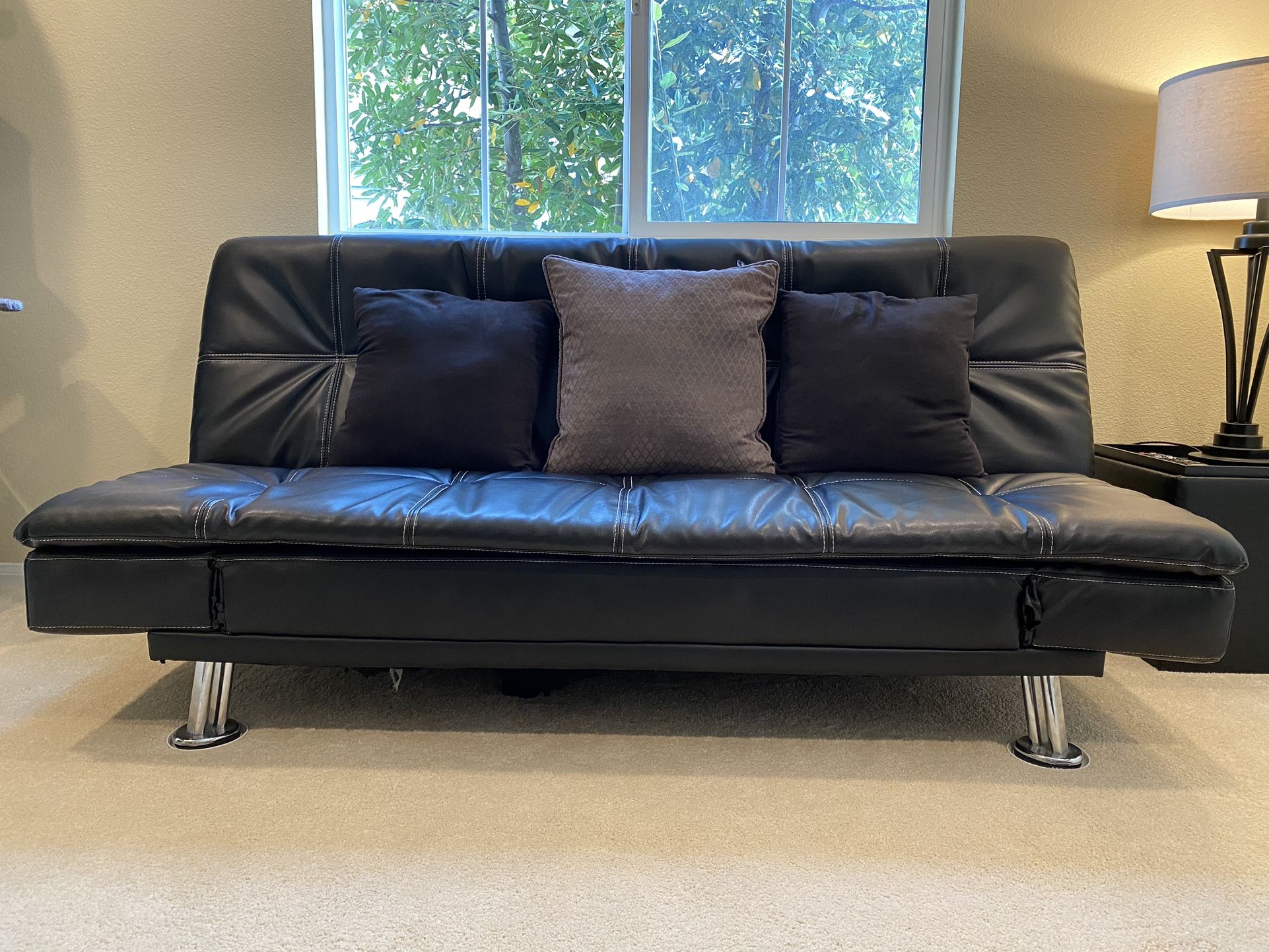 black futon and chaise lounge