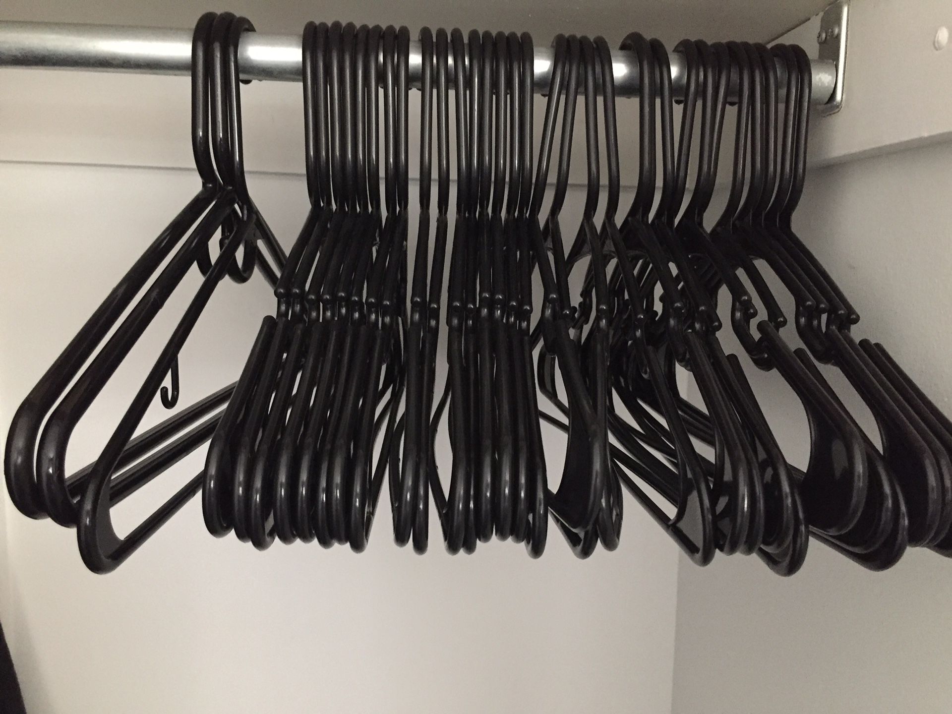 31 black hangers- same size and shape