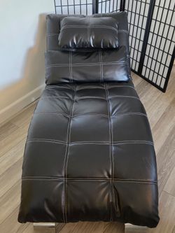 Black faux leather lounge chair