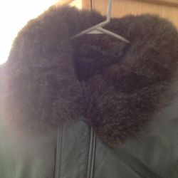 Men's genuine leatherjacket by Andrew Marc with real fur zip in liner.