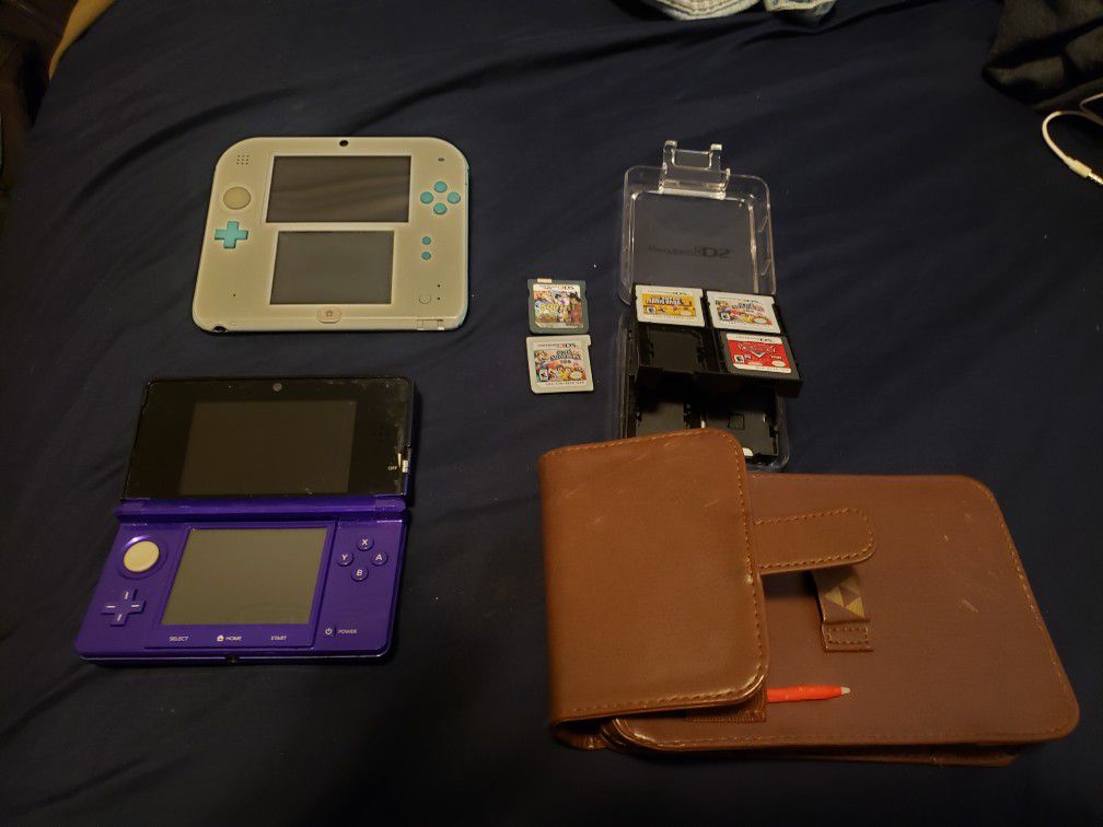 2 Nintendo 3ds with games and carrying case!
