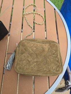 The Austin Designs Crossbody Suede Bag is a stylish and trendy accessory designed for women. With a luxurious suede exterior and a designer theme, thi