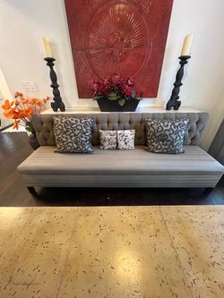 Gray Tufted Upholstered Sofa with Dark Legs Banquet