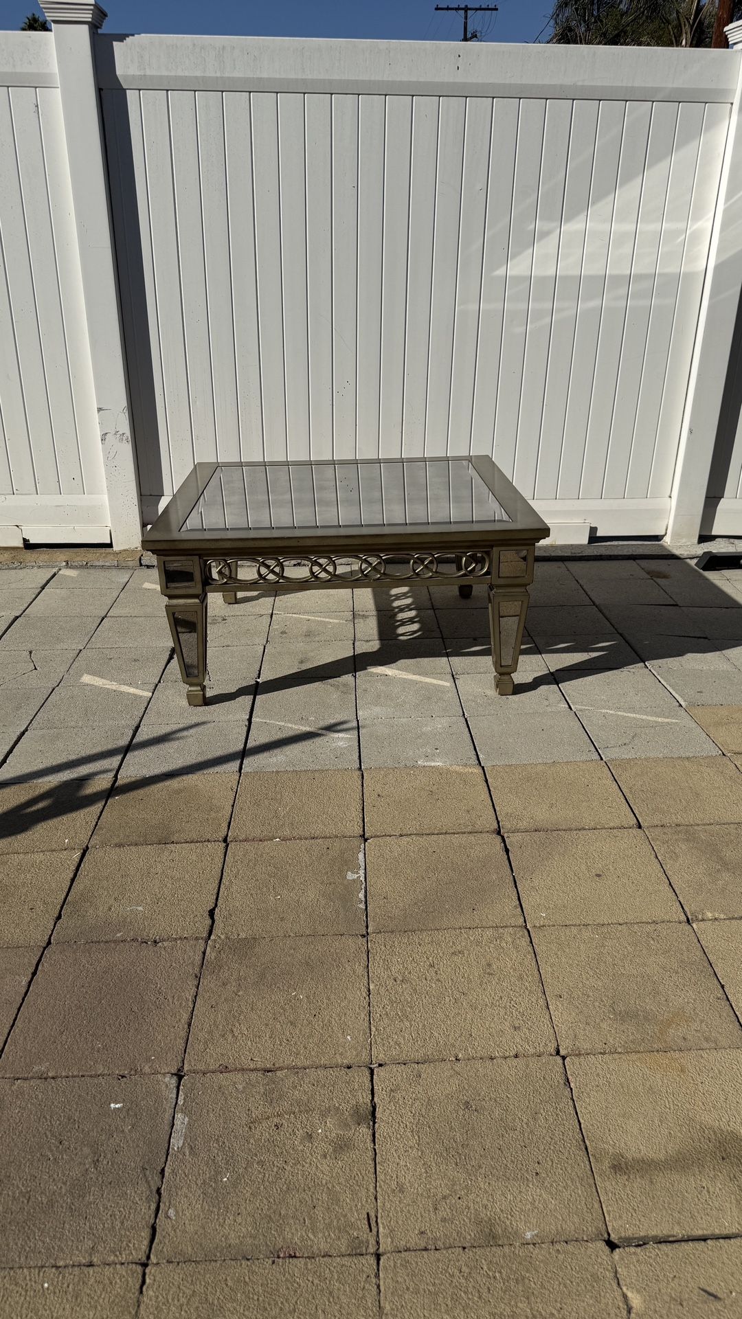 Beveled smoked mirror coffee table