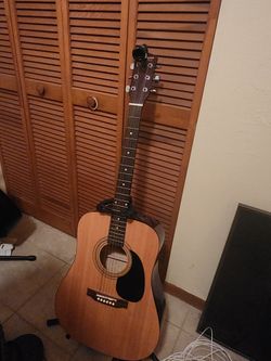 Starcaster acoustic guitar by fender w/stand and tuner