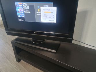 Gently used sofa double recliner with tv and tv stand