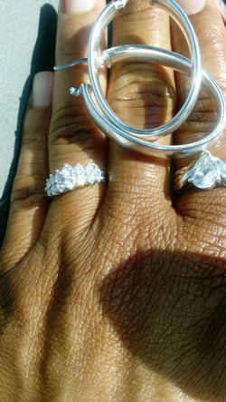 Sterling Silver earrings and two sterling silver rings size 7. Reduce item