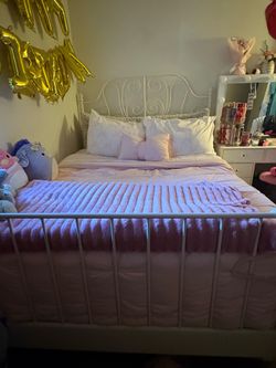 Full White metal bed frame with elegant scroll design headboard and footboard. Good used condition with normal wear.