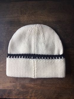 Cc cream and black beanie