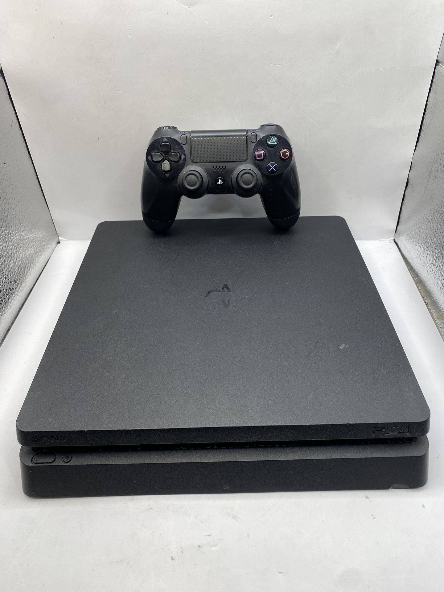 PlayStation 4 Slim 1TB System (PS4 Slim) [Controller And Cords Included] [Good]