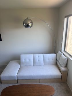 White Couch that folds down to Twin Bed with Storage Drawers and Foot Stool with Storage