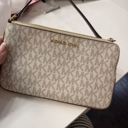 white MK zip wrist bag