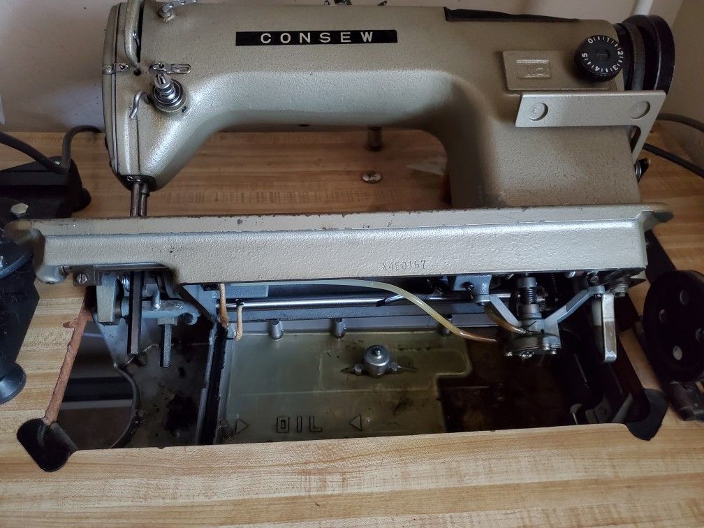 Consew industrial sewing machine with table for Sale in Phoenix, AZ