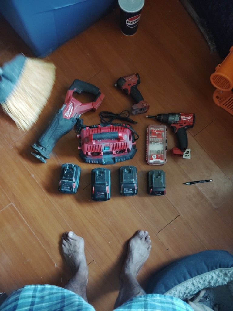 Milwaukee Tool Bundle....4 Batteries, Milwaukee 6 Port Charging Base, Milwaukee SawZall, Milwaukee Drill, Milwaukee Impact Wrench, & Milwaukee 25 PC.