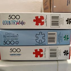 Lot of 3 jigsaw puzzles. All 500 pieces.  Like new in box with posters