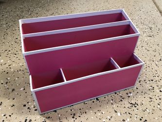 Pink storage bin makeup brushes etc..