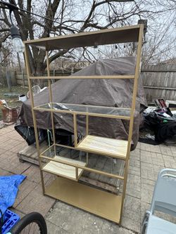 Gold metal glass bookshelf