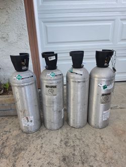 Four Carbon Dioxide 20lb Tanks and one 5lb tank