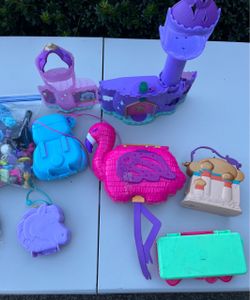 Polly Pockets with Lots of pieces.  See photos