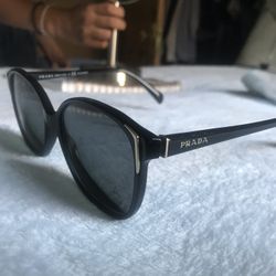 Prada Women’s Sunglasses SPR 010 ( 1AB-5W1 )