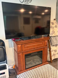 Like new mahogany electric fireplace