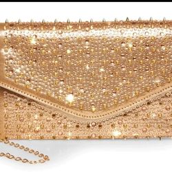 Spike Steve Madden purse and clutch.

Removable strap/chain.

Rose gold color.

Brand new