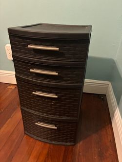 Dark brown plastic storage container