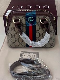 Small brown and light brown purse with box for a woman