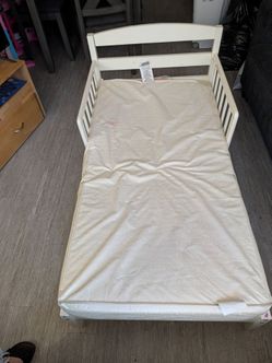 White wooden toddler bed