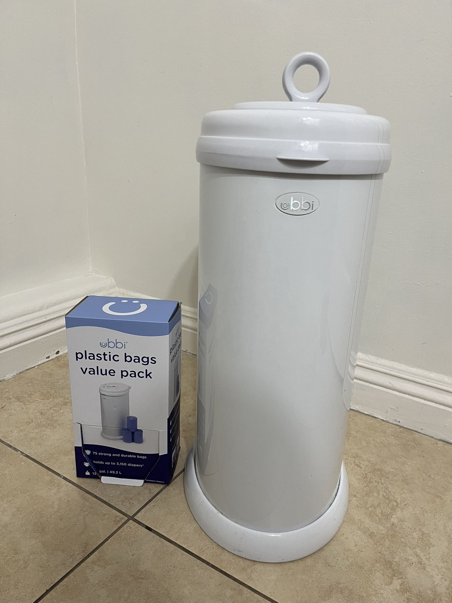 Ubbi diaper pail in great condition, like new, with around 40 bags included