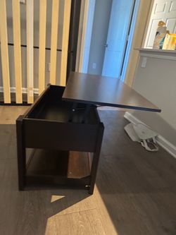 Raising coffee table