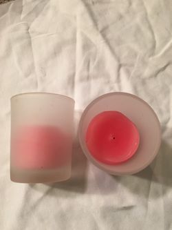 65-72Frosted votive holders with pink candles