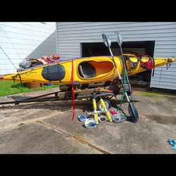 Two Flat Water Kayaks And Trailer 
