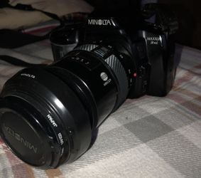 MINOLTA CAMERA WITH EXTENDED LENSE AND CASE!!!