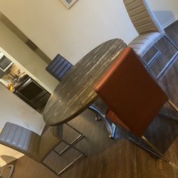 Arland Dark Brown Round Dining Table with 4 set of Upholstered Chair.