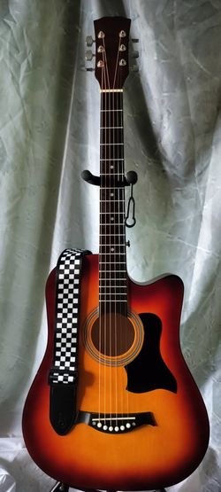 Brand new acoustic guitar with new bag and shoulder strap