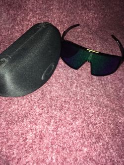 black Oakley Sutro sunglasses with green Prizm lenses sunglasses