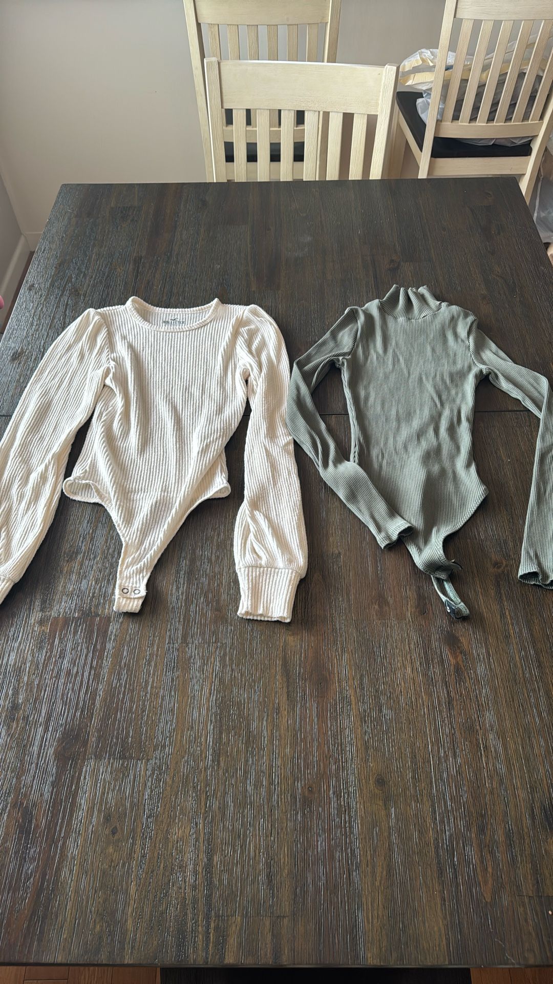 Two XS Bodysuits